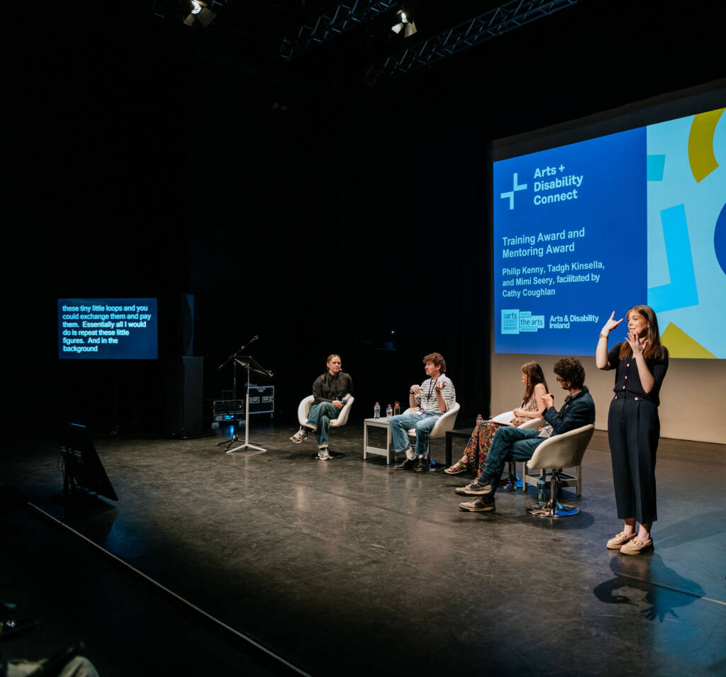 Panelists on a stage for the Arts and Disability Connect ten year celebration