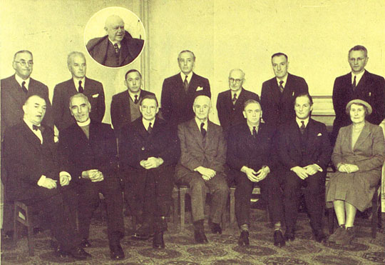 Members of the Arts Council pictured at the first meeting. Six members sit in chairs at the front, while 6 others stand behind them.