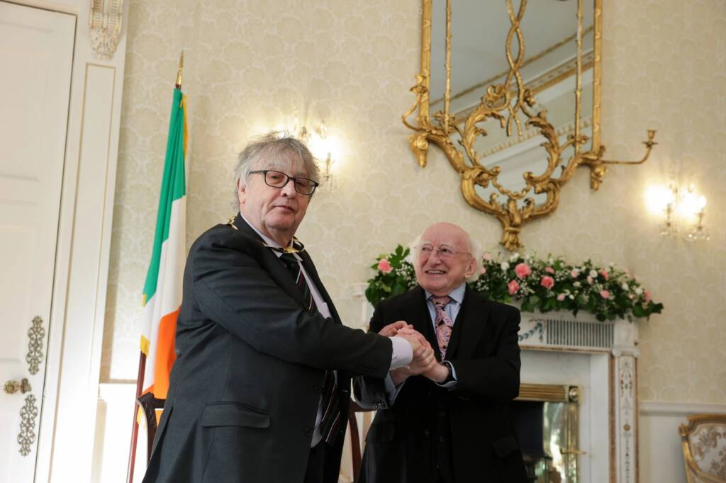 President Michael D. Higgins shakes hands with Paul Muldoon at Áras an Uachtaráin.